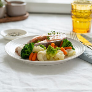 Steam salmon and vegetables. Side view. | Healthy Habits: balanced plate. 