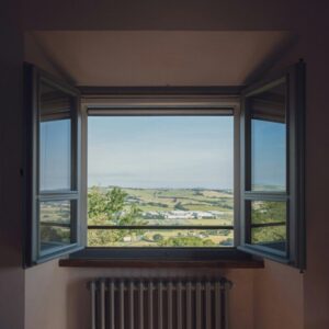 a window with a view of the countryside